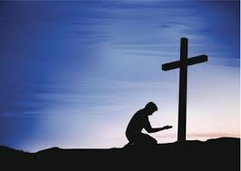 praying at cross